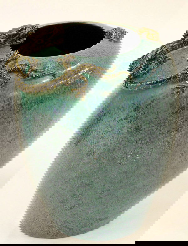 Chinese Glazed vase: Chinese robin's egg glazed vase (lu jun), the ovoid body with inverted rim surmounted by high-relief gilt-accented black dragon and bat figures reserved on the mottled blue and green ground, the base