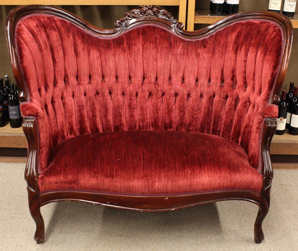 Victorian settee: Victorian style settee, executed in the Rococo Revival taste, having a floral decorated crest above a channelled and tufted back, and rising on cabriole legs, 40''h x 52''w