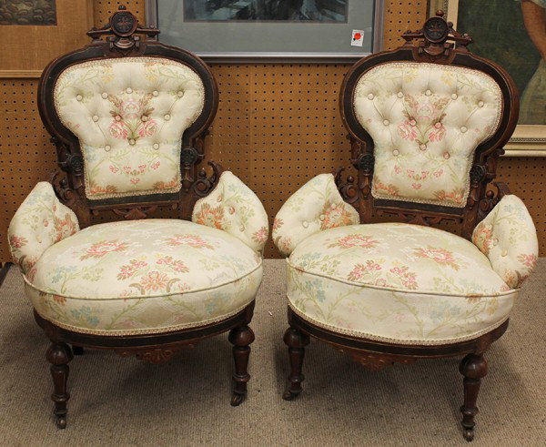 American Victorian chairs N.Y: Pair of American Victorian parlor chairs attributed to Pottier and Stymus, New York circa 1875, executed in walnut and having a partial ebonised surface rising on turned legs terminating on casters, 3