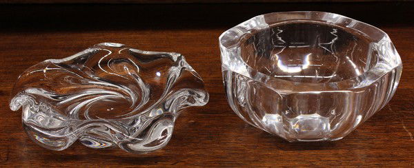 Orrefors crystal group: (lot of 2) Orrefors art glass bowls, one having a wave form body rising on a swirling base 8.5''h, together with an octagonal vase of tapering form, 3.5''h x 7''w (chips)