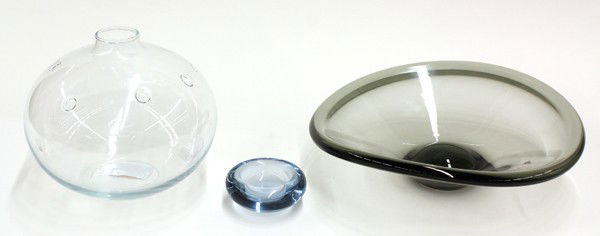 Holmegaard studio glass: (lot of 3) Group of Scandinavian Holmegaard art glass, consisting of a smoky amber footed bowl 3.5''h x 12''w, a blue low bowl 3.5''w, and a clear spherical bowl having pierced detail, 7''h