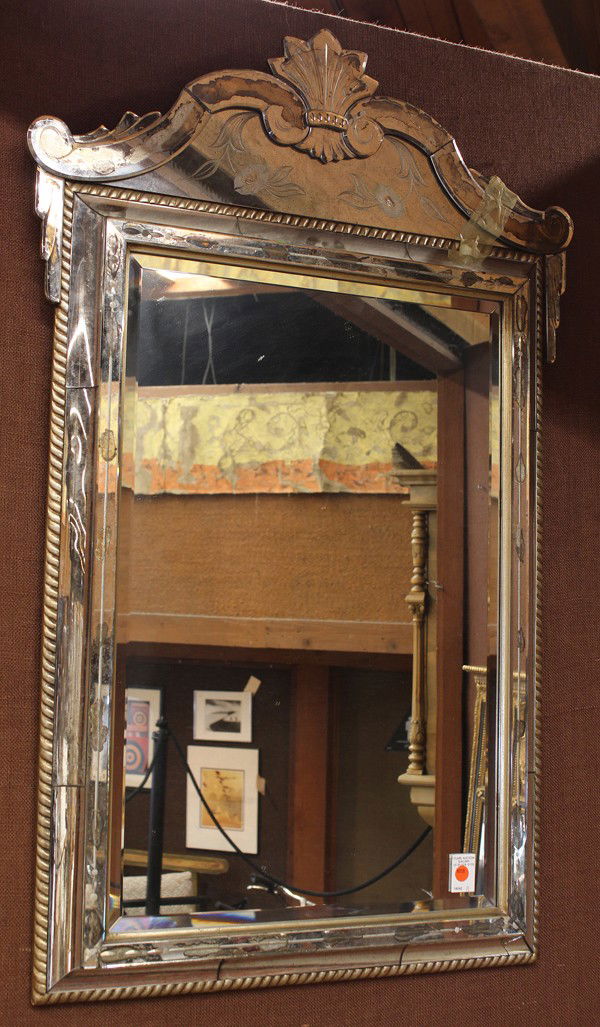 Italian etched looking glass: Italian etched wall mirror, Venetian circa 1900, the shaped crest having floral sprays surmounting the rectangular bevelled looking glass of graduated form accented with an etched leaf detail centered