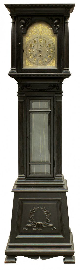 Seth Thomas tall case clock: Seth Thomas tall case clock circa 1900, the case executed in ebonized quarter sawn oak housing the weight driven movement, the upper case with full carved fluted columns flanking the gilt accented dia