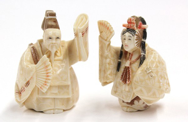 Two Japanese Ivory Figural Netsuke: (lot of 2) Japanese ivory figural netsuke of Noh drama performers, 20th century, each with gilt and polychrome pigment accents, the first in the guise of an elderly man, perhaps Okina, dancing in broc