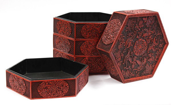 Chinese Large Four Tier Cinnabar Lacquer Box: Chinese large four-tier hexagonal cinnabar lacquer box, the flat recessed lid centered by a high relief design of a peony blossom encircled by five butterflies and scattered floral sprays, further peo