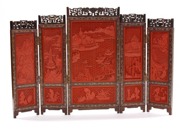 Chinese Cinnabar Lacquer Table Screen: Chinese carved cinnabar lacquer five-section screen, 20th century, the large center and smaller side panels featuring an extensive landscape with viewing pavilions, country villas and temple buildings