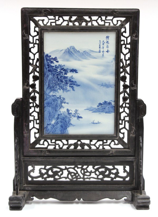 Chinese Table Screen with Paintd Porcelain Plaque: Chinese two-section table screen with a large blue-and-white porcelain plaque, the rectangular plaque decorated in shades of underglaze blue with two figures boating on river bordered by wooded cliffs