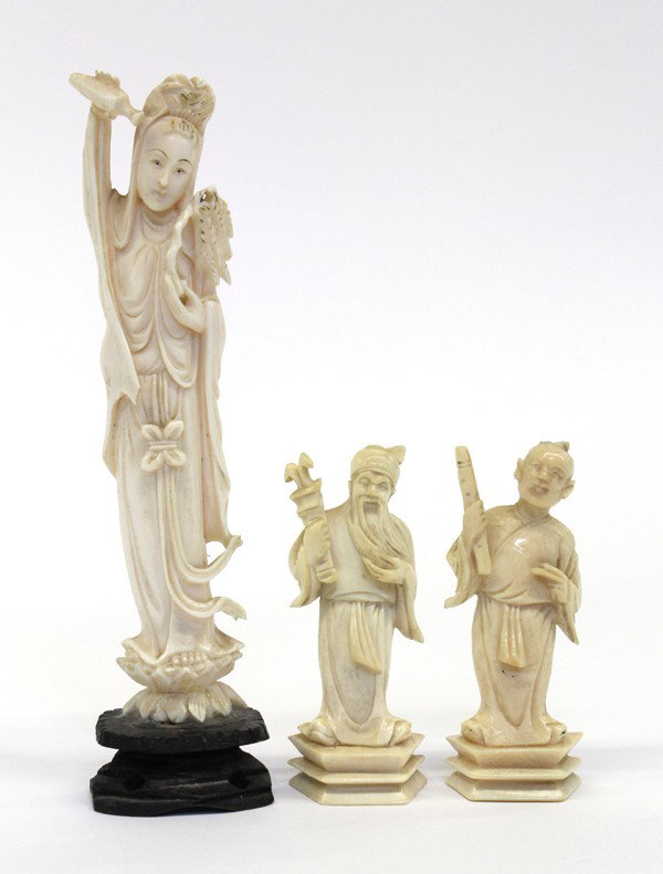 Group of Chinese Ivory Figures: (Lot of 3) Assorted Chinese ivory figural carvings, consisting of two of the Eight Daoist Immortals Zhang Guo Lao and Han Xiang Zi with associated attributes, together with a figure of Guanyin holding