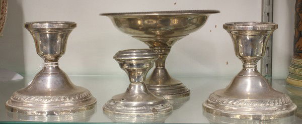 Sterling table accessories: Four associated sterling silver table accessories including a pair of 3.5'' candle holders, 2.5'' candle hodler, and a pedestal bowl 4''