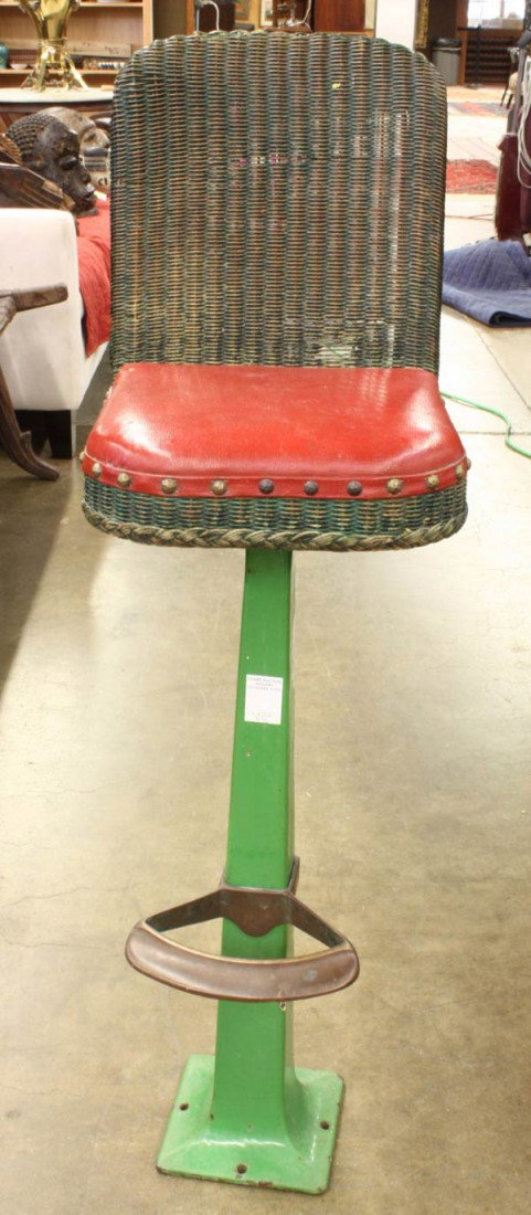 Vintage bar stool: Vintage bar stool with a wicker back and red leather upholstered seat, 41''h