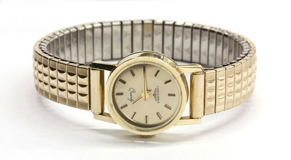 Longines wristwatch: LONGINES quartz wristwatch; of yellow gold (stamped) 14k, having six jewels movement, expandible bracelet marked 1/40 10k R.G.P. top stainless steel. Total wristwatch weight 24.3 grams. Inside of case