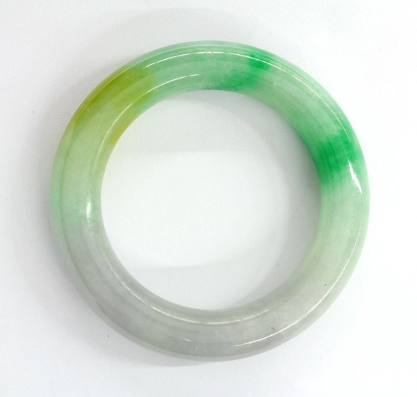 Tri-color jade bangle bracelet: Tri-color jade bangle bracelet; measuring 6 1/4'' diameter. Including a box