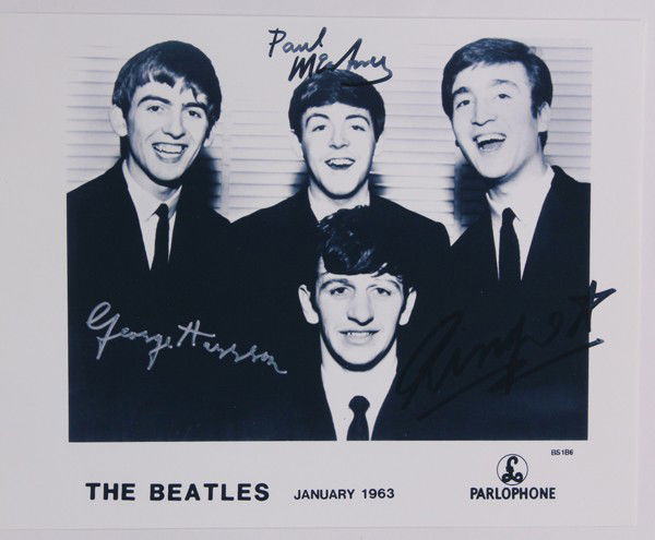 Beatles autographed photographs: (lot of 2) Associated Beatles photographs, one autographed and signed by three of the Beatles, George Harrison, Paul McCartney, and Ringo Starr, The Beatles January 1963, Parlophone, together with a s