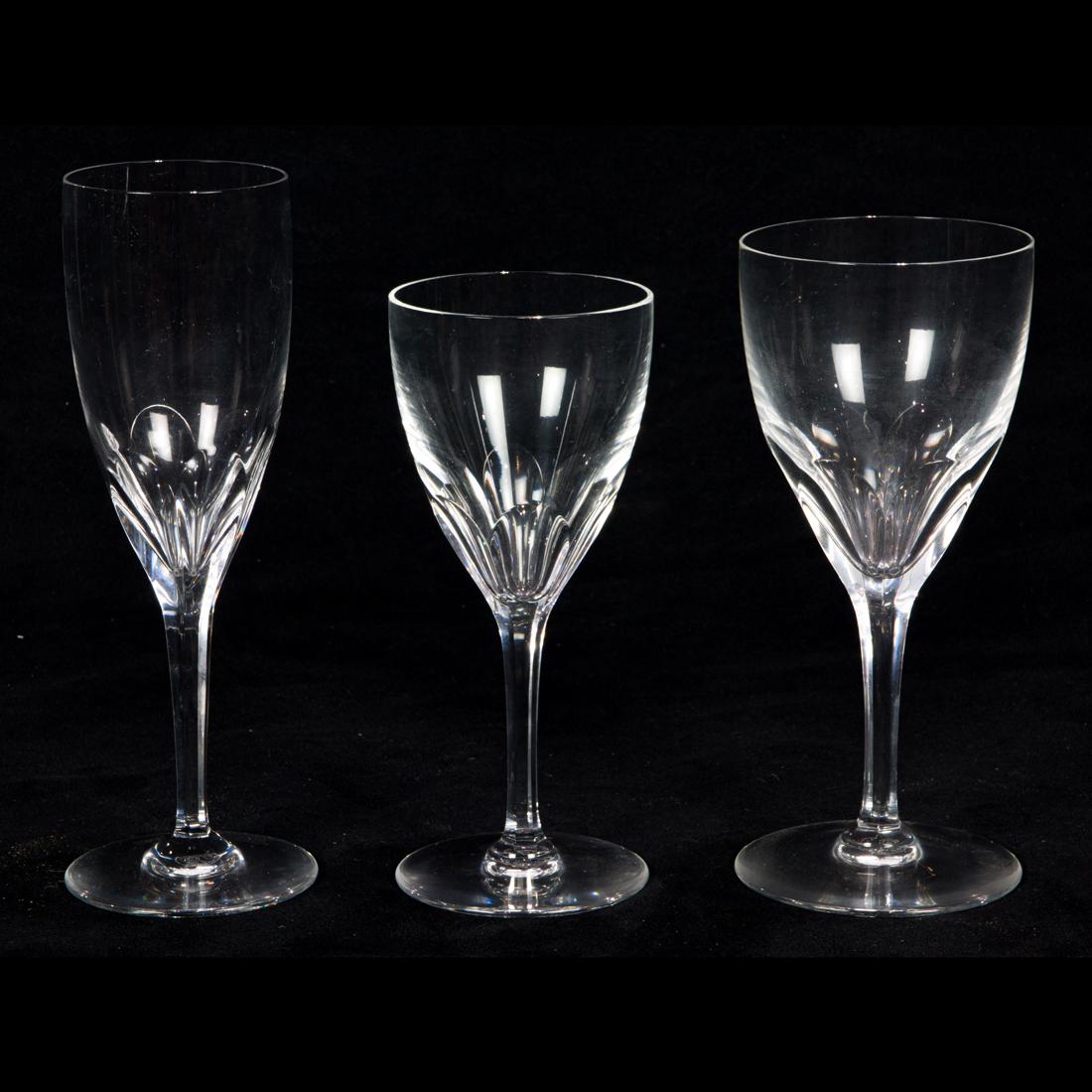 (Lot of 25) A suite of Baccarat cut glass stemware in the Genova pattern: (Lot of 25) A suite of Baccarat cut glass stemware in the Genova pattern, each with acid etched factory mark, comprising (8) goblets, 7.5"h; (8) wine, 7"h and (9) flutes, 8.25"h.