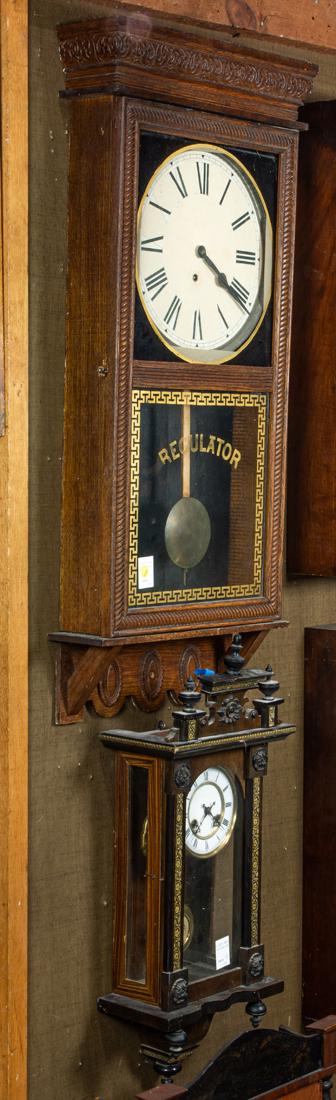 (Lot of 2) Ingraham oak regulator wall clock and a Vienna style parcel ebonized wall clock: (Lot of 2) Ingraham oak regulator wall clock and a Vienna style parcel ebonized wall clock, greatest 38"h x 17"w.