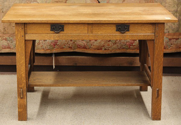 Gustav Stickley writing desk: Gustav stickley oak arts and crafts and crafts writing desk, New York circa 1910, the rectangular top having an overhanging top above the two drawer case retaining original pulls and rising on square 