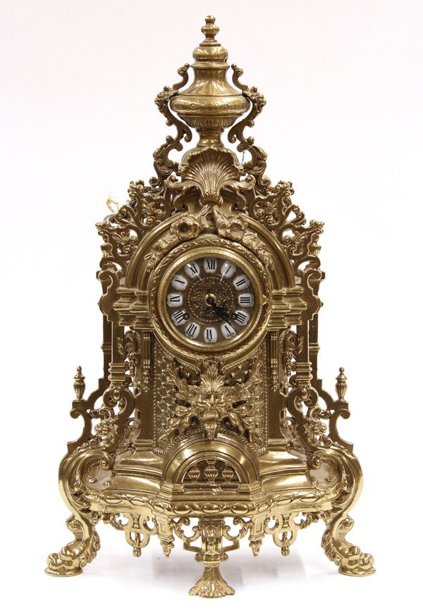Louis XV style mantle clock: Louis XV style gilt bronze mantle clock, the finial capped gilt case having a shell form mount above the floral accented dial marked Imperial having raised Roman numeral markers fronting the German mo
