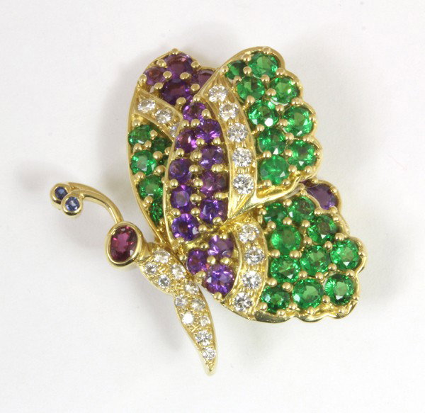 Amethyst tsavorite diamond ''Butterfly'' brooch: Amethyst, tsavorite garnet and diamond ''Butterfly'' brooch, by Jean Vitau; of 18k yellow gold. Total brooch weight 14.7 grams