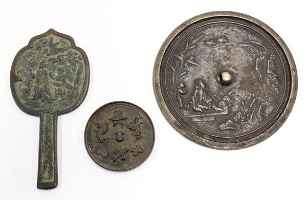 Three Chinese Bronze Mirrors, Figures: (Lot of 3) Chinese bronze mirrors, consisting of one circular mirror cast with a figure seated on the banks of a lotus pond along with an attendant; the second with a scene of two figures holding an a