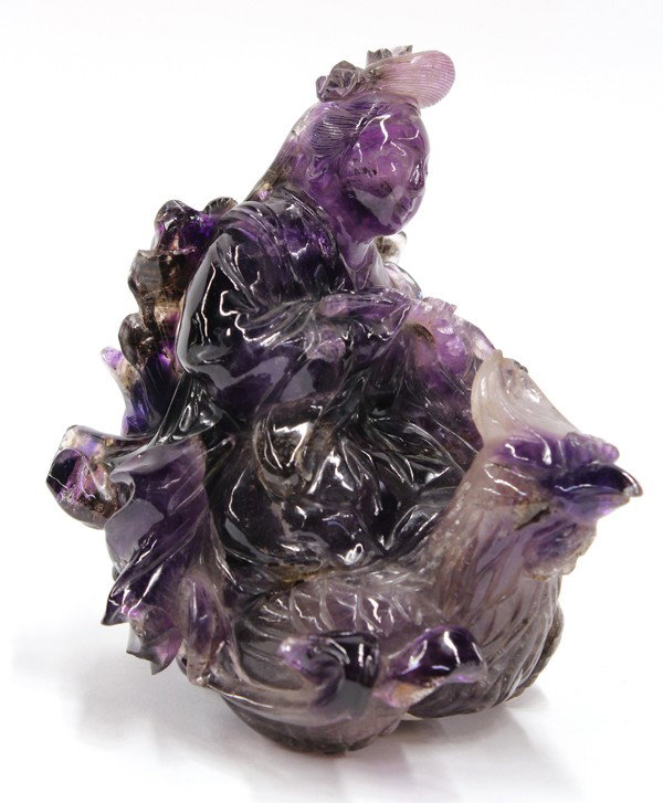 Chinese Amethyist Figural Carving of Queen Mother: Chinese amethyst carving of Xi Wang Mu (Queen Mother of the West), the female deity portrayed riding on a large phoenix with a basket of flowers suspended from her hands, the translucent light and dar