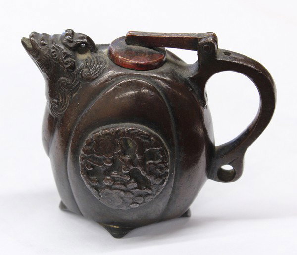 Chinese Patinated Bronze Water Dropper, Qing: Chinese patinated bronze water dropper, Qing dynasty, cast as a melon-form ewer with the head of a bird and a loop handle, the hinged lid a later replacement, 2.5''h