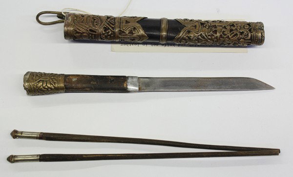 Mongolian Utensil Set: Mongolian traveling utensil set, late 19th/early 20th century, consisting of a knife and pair of chopstick fitted into a wooden scabbard covered in leather and applied with reticulated copper bands wo
