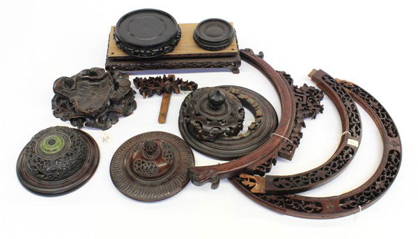 Group Chinese Reticulated Covers/Wood Stands: (Lot of 8) Group of Chinese carved wood reticulated covers and stands, consisting: of three pierced lids (one broken), one stand carved with a lotus leaves, two circular stands, one rectangular stand,