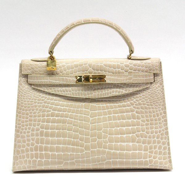 Lederer 32 patent nude kelly bag: Lederer (Hermes) 32 patent nude porosus crocodile Kelly bag with gilt hardware, with lock, marked Lederer De Paris Made in Italy, note: all measurements are in centimeters, 24h x 32w x 11d, handle dro