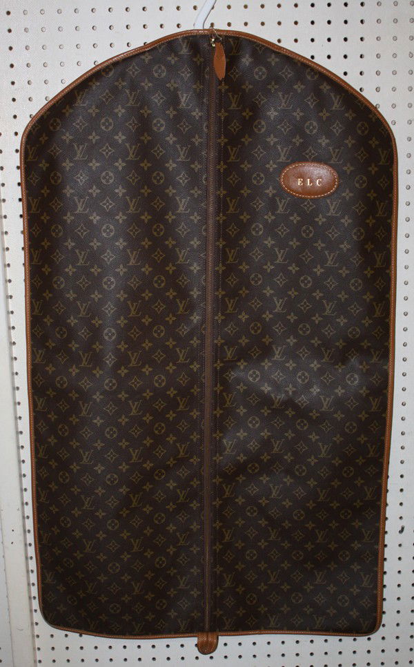 Louis Vuitton luggage: (lot of 2) Louis Vuitton associated luggage including a hard case suitcase, interior paper lable reads 'Louis Vuitton 912906 Av Marceau 78 Paris Nice.2 Av De Suede' 17''h x 19.5''w x 6.75''d; together