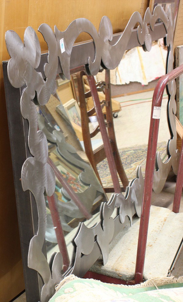 Agnes Bourne mirror: Agnes Bourne mirror with matte wire brush finish and plasma cut applied scrolls 74''h