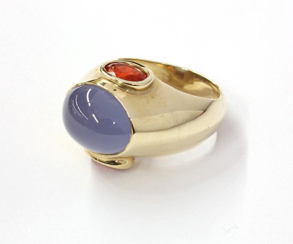 Chalcedony and Fire Opal Ring: Chalcedony and fire opal ring; mounted in 14k yellow gold. Total weight 13.5 grams. Ring size 6.25