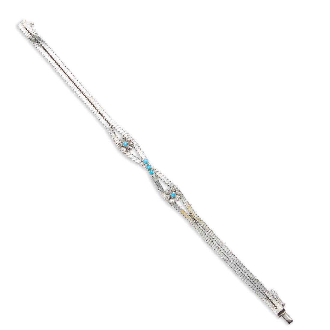 A turquoise and eighteen karat white gold bracelet (1 of 2)