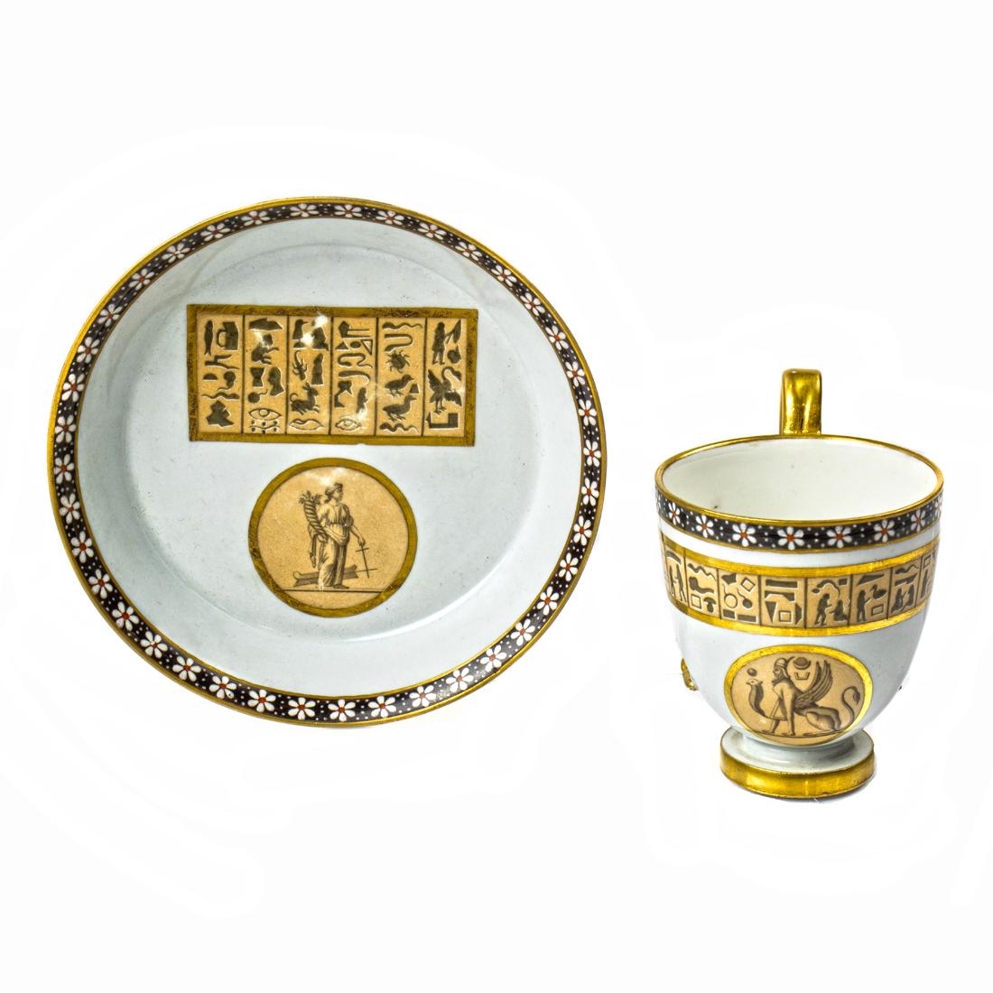 A Vienna porcelain cup and saucer in the Egyptian Revival taste, early 19th century, (1 of 2)