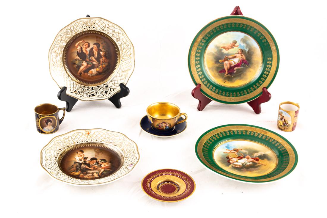 (lot of 9) Continental Vienna style porcelains, 20th century: (lot of 9) Continental Vienna style porcelains, 20th century, comprising a pair gilt stenciled green bordered plates decaled decorated with Venus seating on a cloud with amorini and an associated coba