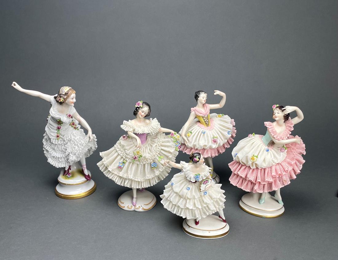 (Lot of 5) Rudolstadt Volkstedt lace porcelain figures of ballerinas: (Lot of 5) Rudolstadt Volkstedt lace porcelain figures of ballerinas, each with underglaze blue crowned monogram mark, greatest 8.25"h. Provenance: Property of a prominent Hillsborough, CA estate.