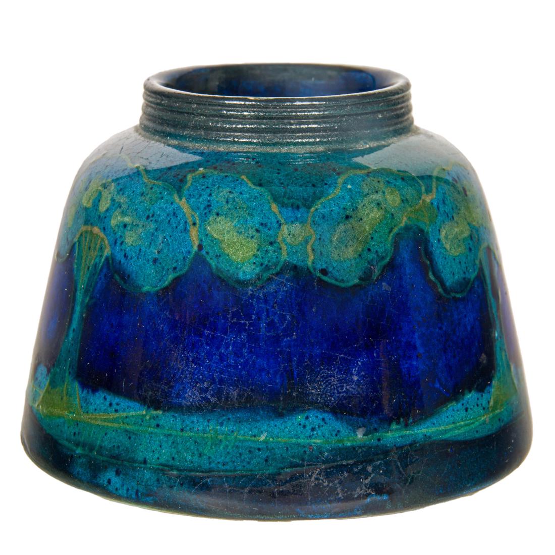 A Moorcroft pottery Moonlit Blue Landscape inkwell: A Moorcroft pottery Moonlit Blue Landscape inkwell, circa 1924, impressed 'MOORCROFT, MADE IN ENGLAND' and indistinctly '181', 2.25"h x 3"dia. Provenance: Property from the estate of Steve Yvaska, lon