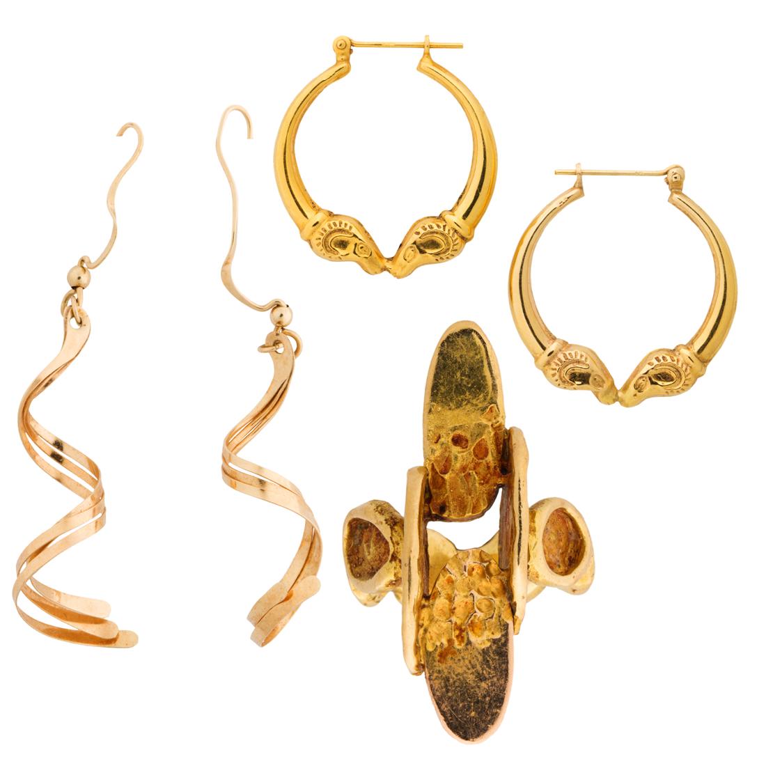 A Group Of Gold Earrings And Ring
