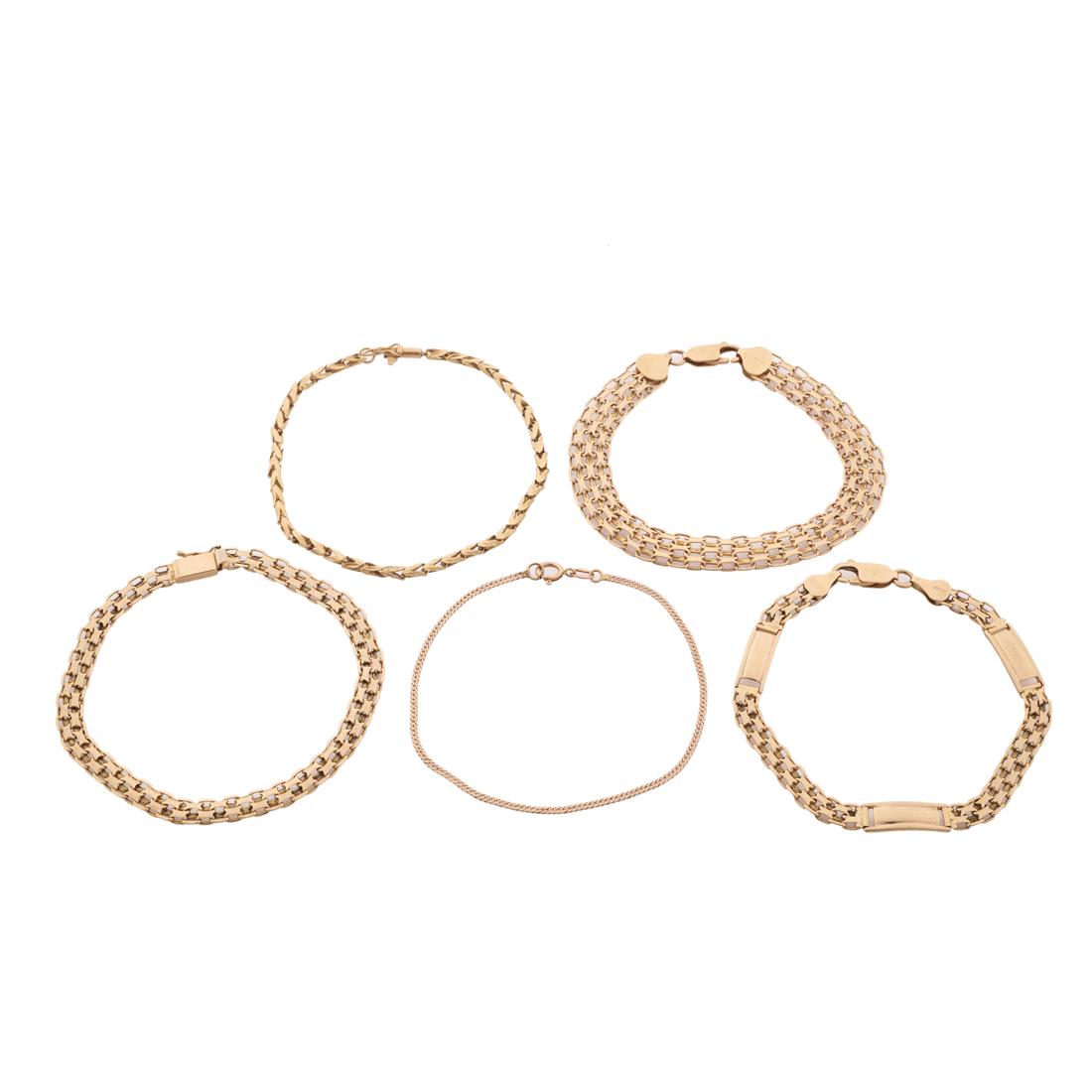 A group of fourteen karat gold bracelets: A group of fourteen karat gold braceletsincluding four link bracelets. 20.0 dwt; length: 7 1/2-7 3/4 in
