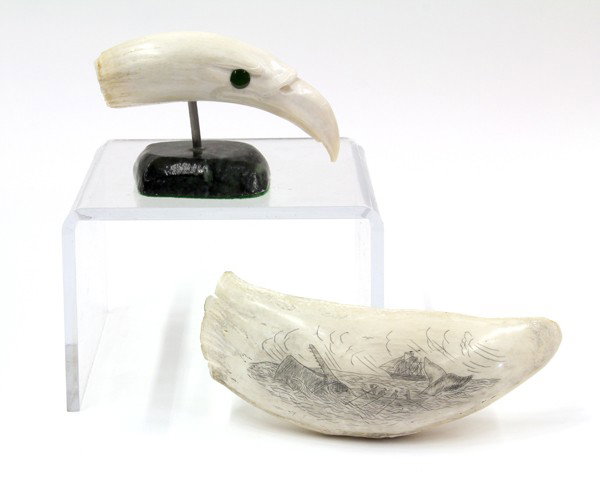 Decorative Scrimshaw group: (lot of 2) Decorative ivory and scrimshaw style group consisting of a bird form carved ivory tooth, the beak with green glass eyes, and rising on a veriegated stone base, 2.8''h x 4.5''h; together wit