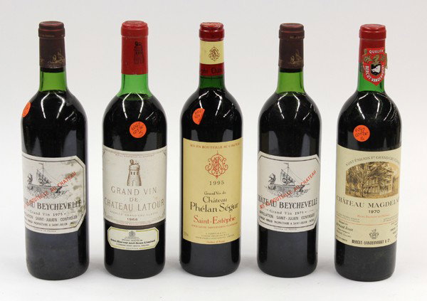 French wine group: (lot of 5) Bottles of French wine consisting of 1970 Chateau Magdelaine, 2 bottles of 1975 Chateau Beychevelle, Saint Julien, 1995 Chateau Phelan Segur Saint-Estephe, and 1968 Grand Vin de Chateau Lat