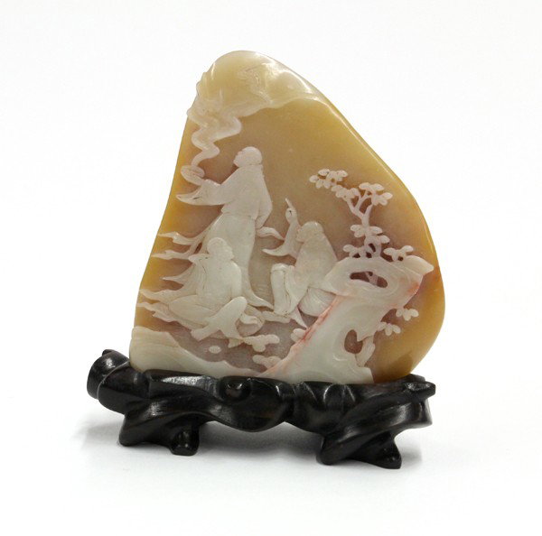 Chinese Soapstone Pebble, Luohan: Chinese tan colored soapstone pebble, carved with three luohan with one releasing a pair of auspicious bats out of an alms bowl, the cloud scroll wrapping to the reverse and accenting the stylized mou
