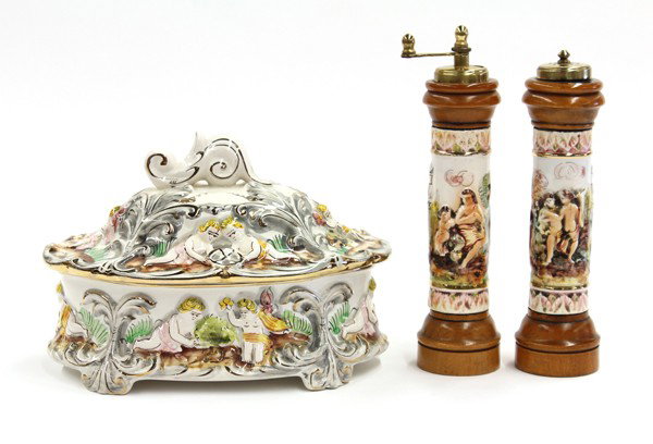 Group of Continental dishware: (Lot of 4) Group of Continental dishware comprising wooden salt and pepper mills with porcelain panel depicting genre scenes, marked Made in Italy C.C, 9''h; together with a oval shaped bowl having a 