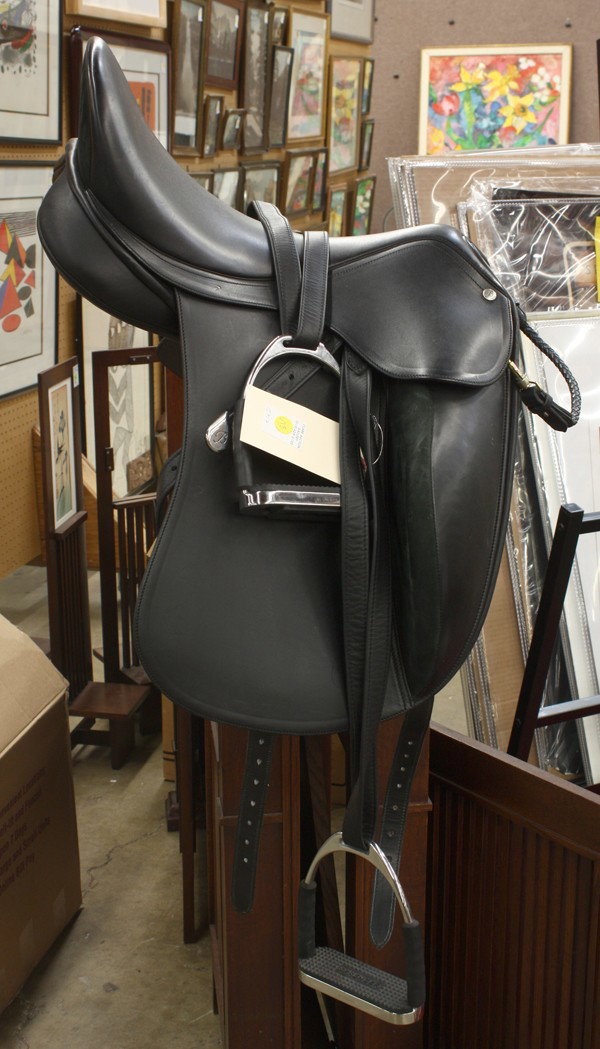Bates Innova dressage saddle: (lot of 2) Bates Innova dressage saddle, in black calf leather, made in Australia, with with CAIR and an easy-change gullet system, includes Sprenger stirrups, and soft padded case