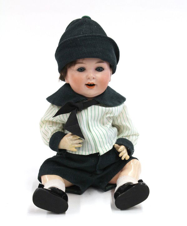 Bisque socket head doll: German Antique bisque socket head boy doll, by Armand Marseilles, having hand painted facial features, blue set eyes, open mouth with two upper teeth, on a composition body, appropriately dressed, mar