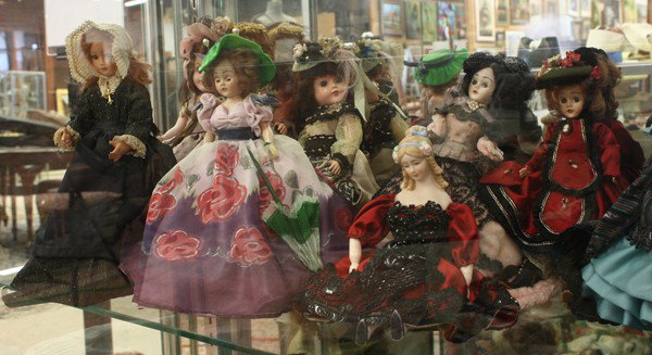 Group of dolls: (lot of 15) Associated antique and vintage dolls consisting of a French bisque head doll, Victorian bisque on cloth bodies with painted facial and limb accents; three wax half dolls, two mounted as la