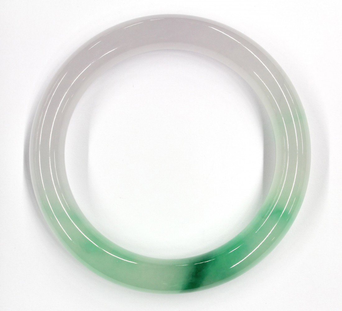 Full jade bangle bracelet: Full jade two toned bangle bracelet; having green and lavender jade. Inside measuring approximately 7'' diameter