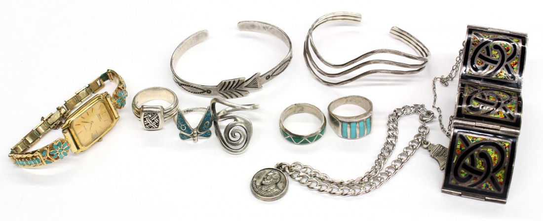 Collection of mostly silver jewelry items: Collection of mostly silver jewelry items, including; a gold tone Seiko watch with a 14k yellow gold bracelet with turquoise inlay and floral design; sterling link charm bracelet with two charms weigh