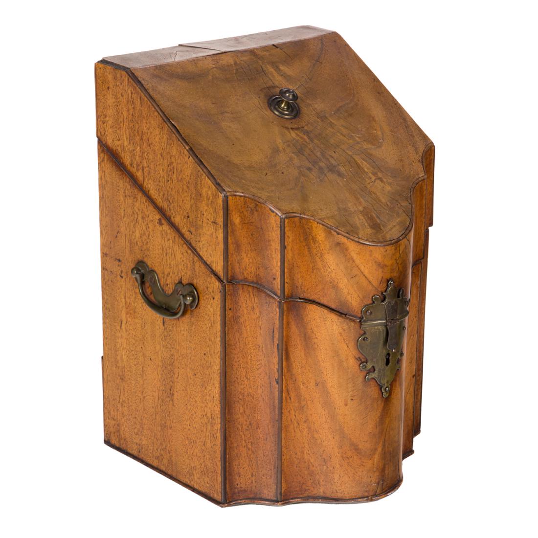 A George III mahogany letter box, late 18th/early 19 century: George III Letter Box England, late 18th/early 19 century, the arc-en-arbalete front with hinged cover opening to a fitted interior, 13.5"h x 9"w x 9"d. Provenance: Property from the collection of cel
