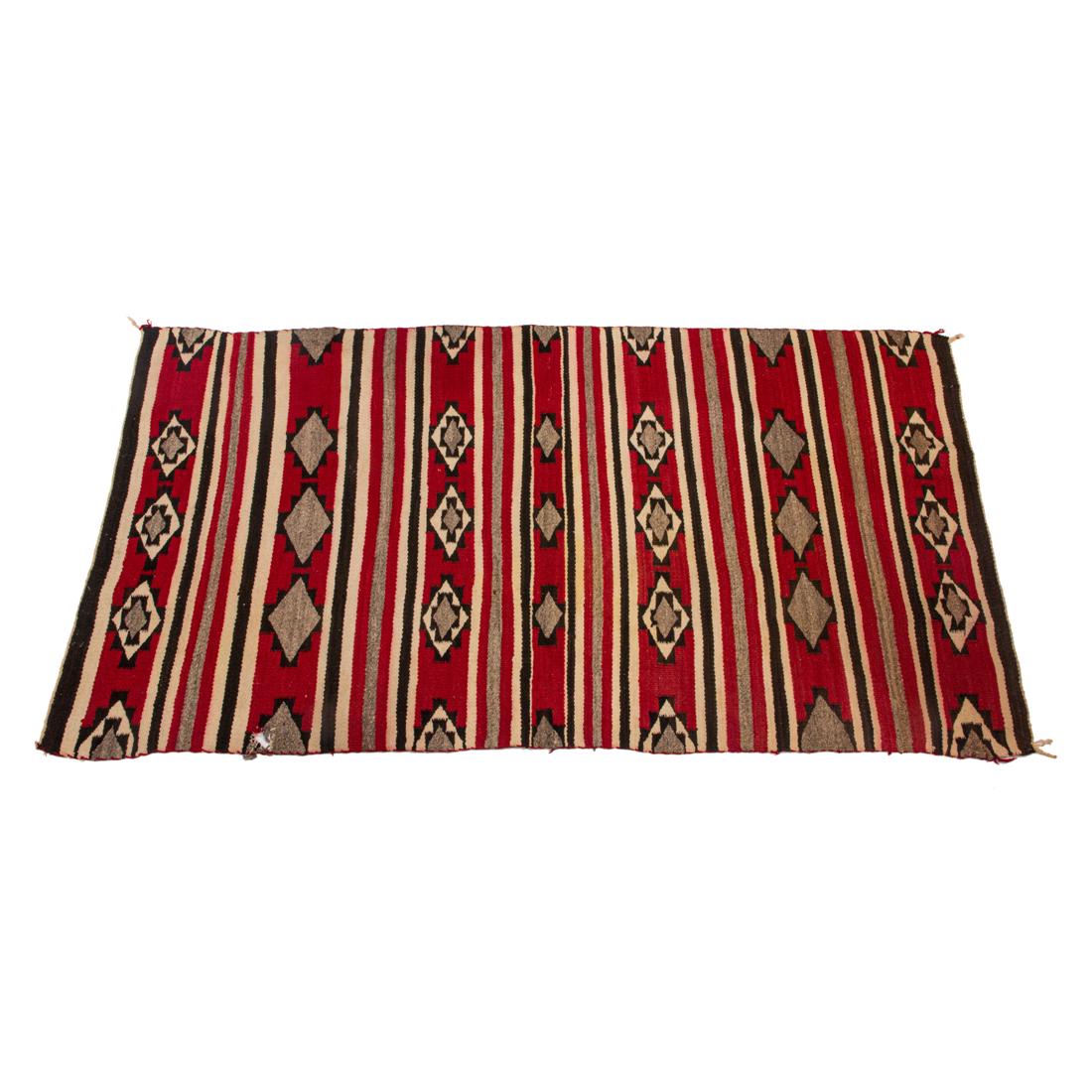 A Navajo blanket, the ivory, black, red and gray striped weaving (1 of 2)