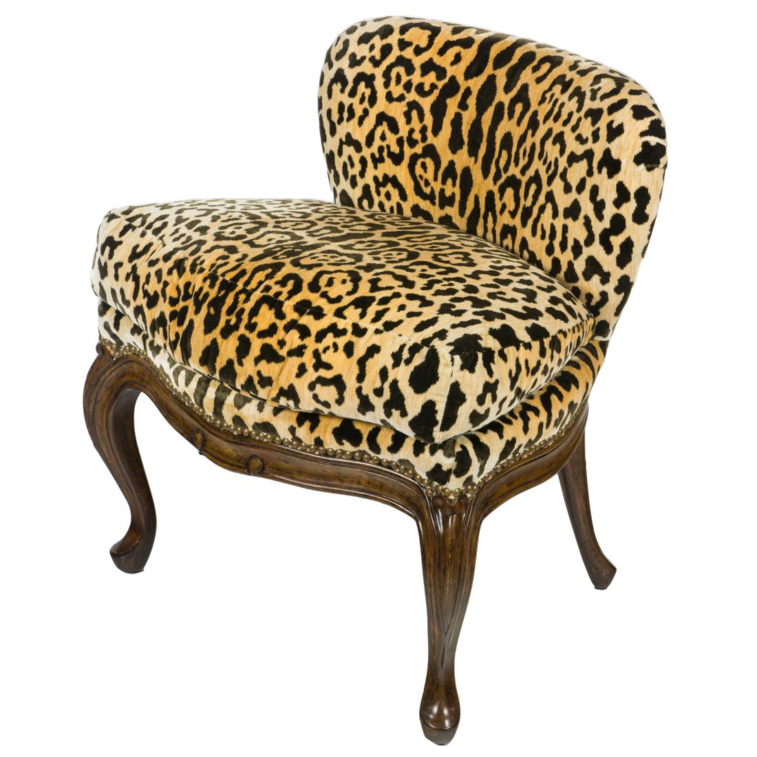 A Michael Taylor leopard print slipper chair: A Michael Taylor leopard print slipper chair, having a shaped back and rising on cabriole legs, 27"h